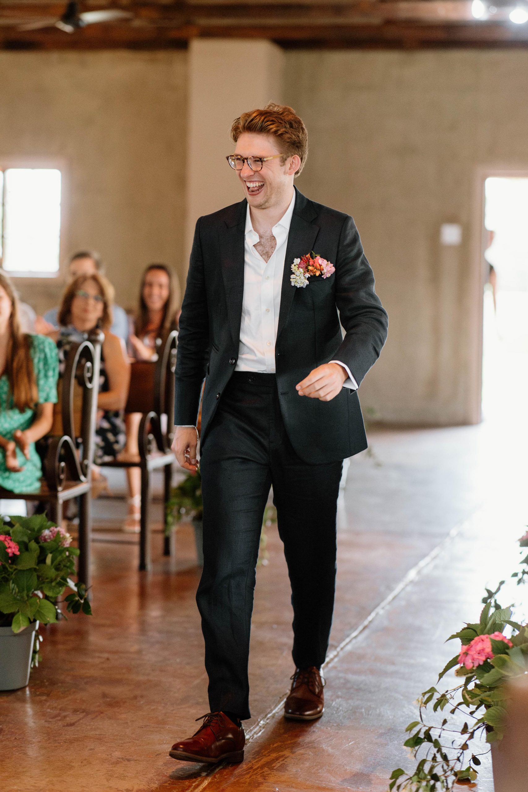 Groom walking down the aisle during a wedding ceremony at Lezar Opstal Wedding Venue Heidelberg