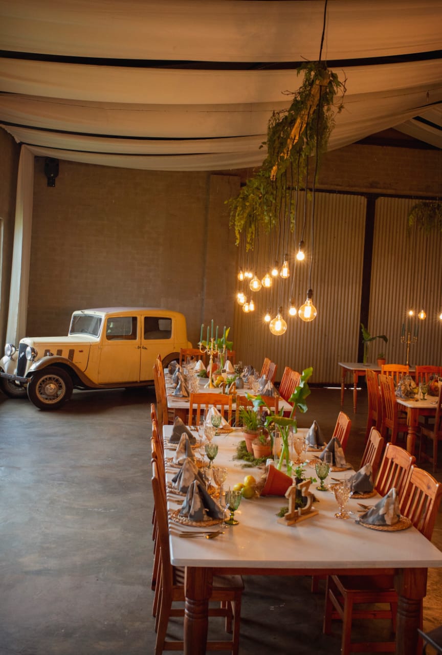 Rustic wedding setting with a vintage rustic car in the background at Lezar Opstal Wedding Venue Heidelberg