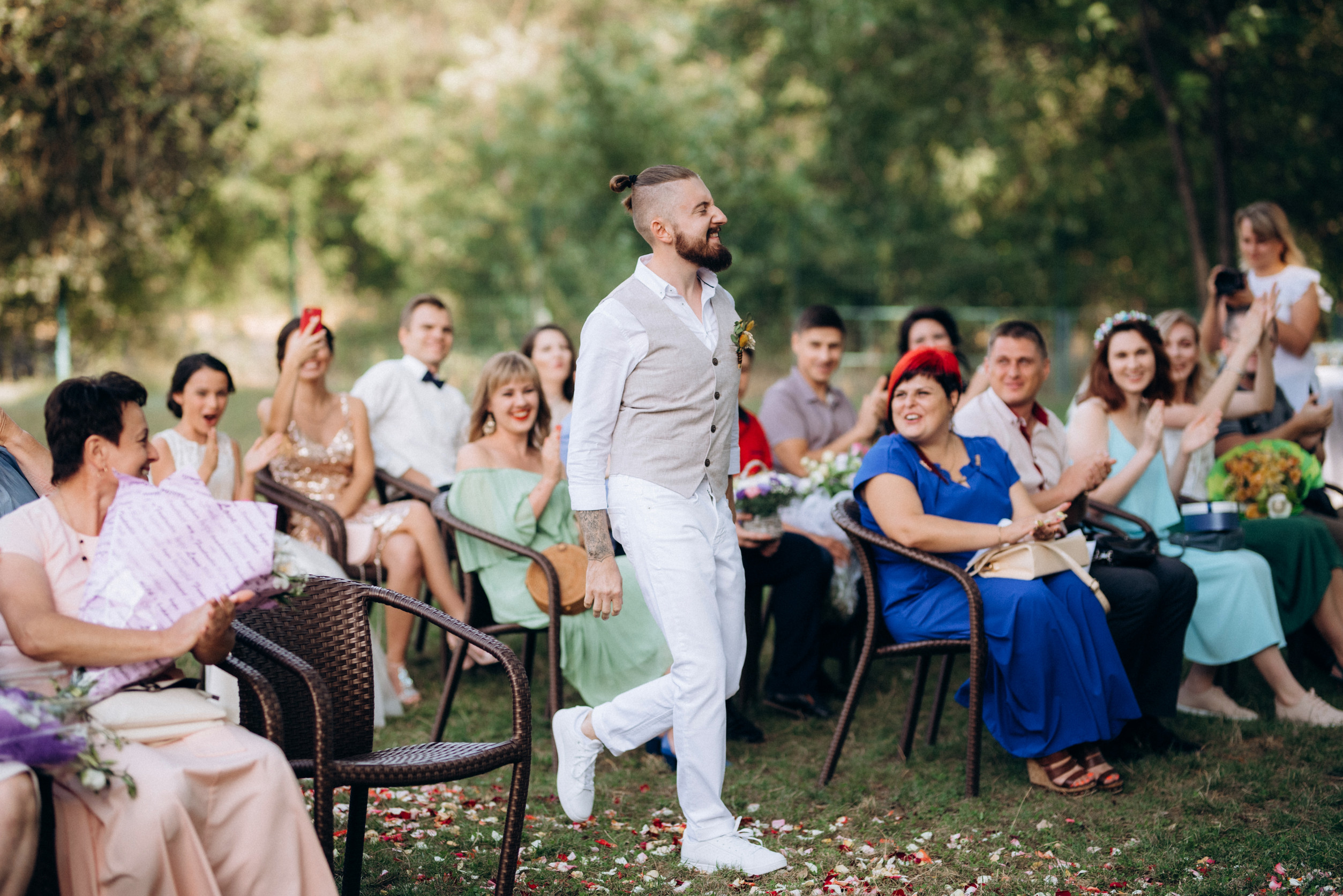 Groom walking down aisle during outdoor wedding ceremony at Lezar Opstal Heidelberg Gauteng